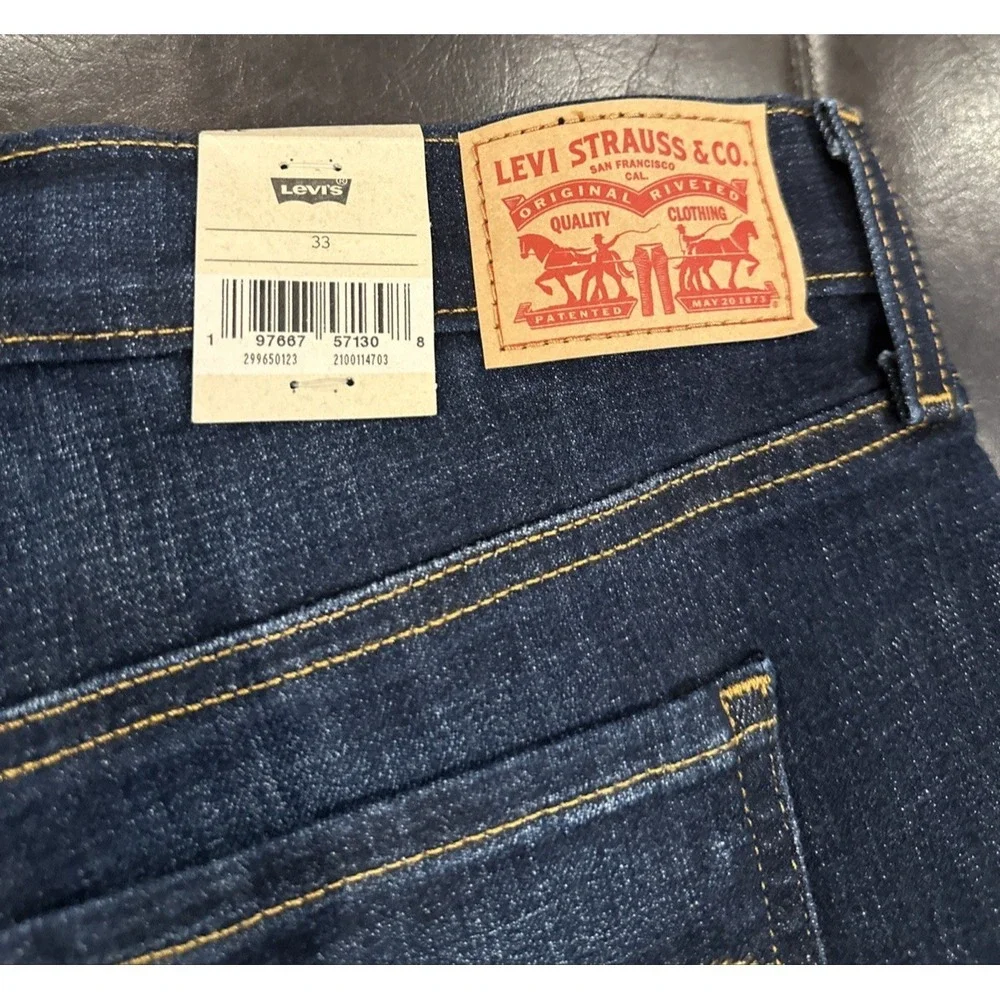 Levi's Women Size 33 Mid Length Blue Denim Shorts Cuffed Dark Distressed Stretch